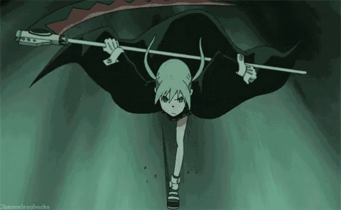 a girl in a black cape is holding a long stick in her hand .