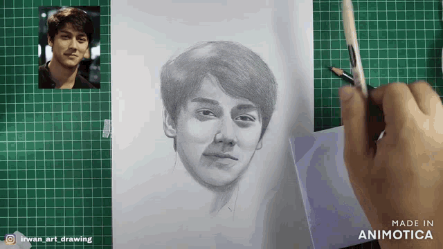 a drawing of a man 's face is being made in animatica