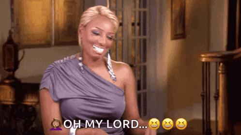 a woman in a purple dress is smiling and saying `` oh my lord ... '' .