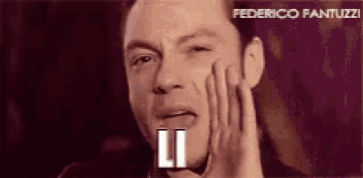 a close up of a man 's face with the word federico fantuzzi written above him