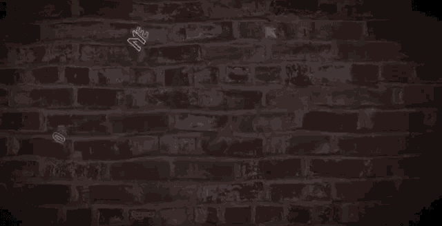 a neon sign says me tiens on fire on a brick wall