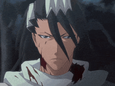 a close up of a man 's face with blood on his neck