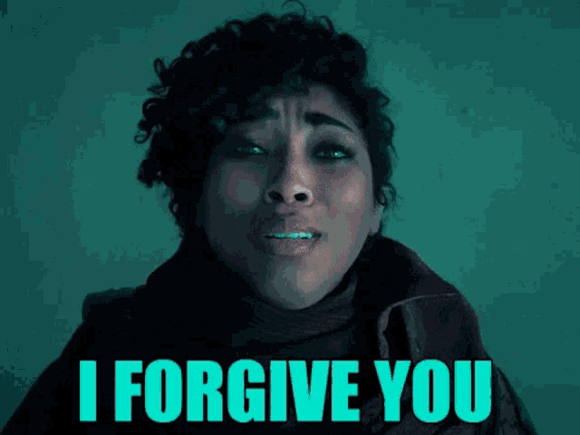 a woman with braces on her teeth is crying and says i forgive you