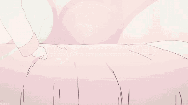 a girl with long black hair is laying on a bed with a pink blanket