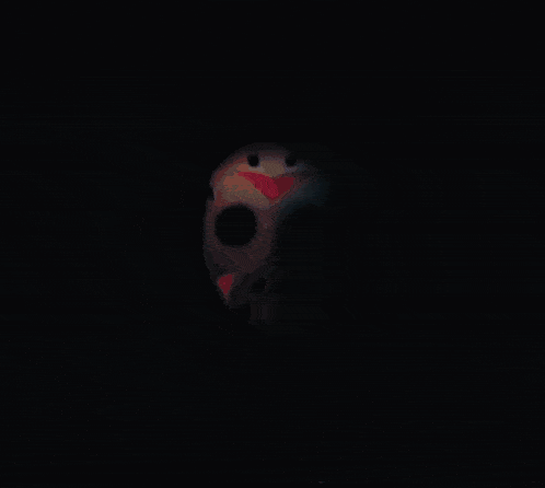 a skull with glowing eyes is surrounded by purple and blue lights