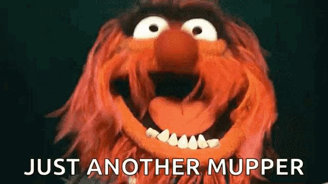 a close up of a muppet with its mouth open and the words `` just another muppet '' above it .