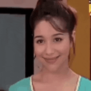 a close up of a woman 's face with a smile on her face .