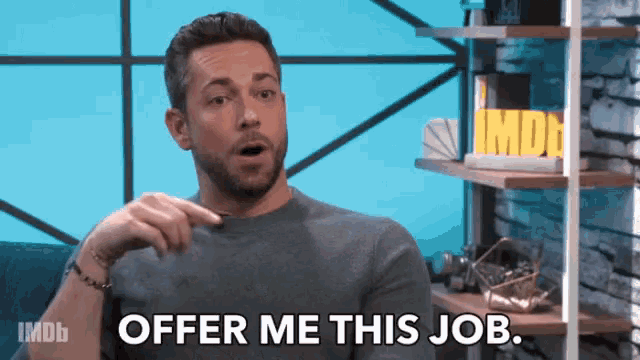 a man says offer me this job in front of a shelf with imdb on it