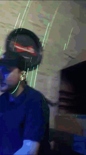 a blurry picture of a person wearing headphones and a hat
