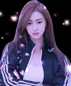 a woman in a black jacket with white stripes on the sleeves is standing in front of a black background .