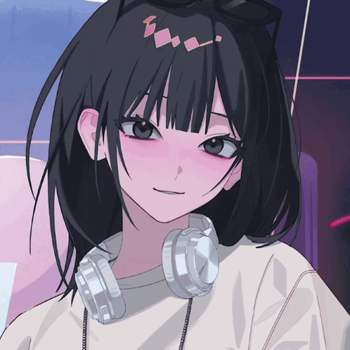 a girl with black hair and headphones around her neck is smiling