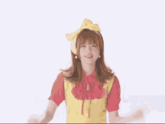 a woman wearing a yellow apron and a yellow bow on her head .