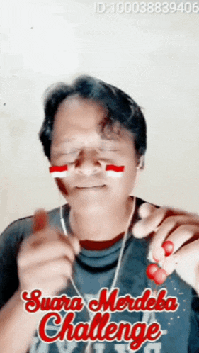 a man with a flag on his face and the words suara merdeka challenge