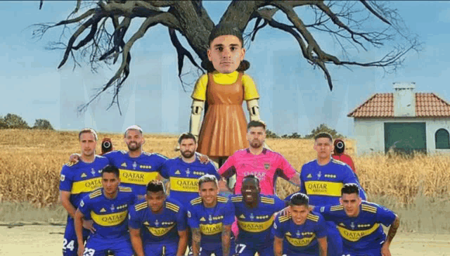 a group of soccer players wearing qatar jerseys pose in front of a tree