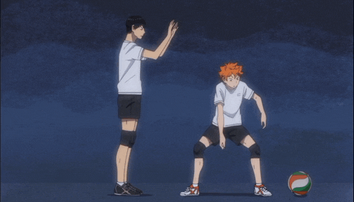 two volleyball players are standing next to each other with one wearing a shirt that says ' tokyo ' on it