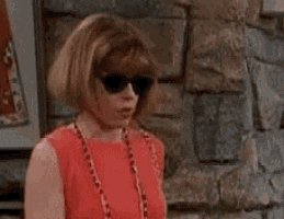 a woman wearing sunglasses and a red dress is saying oh , i definitely object !