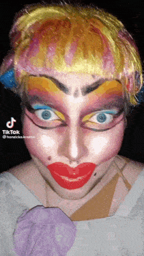a tiktok video of a person with a clown makeup on their face