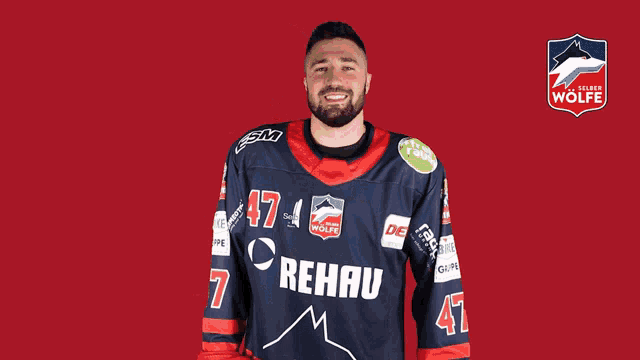 a man wearing a jersey that says rehau