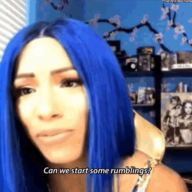 a woman with blue hair is asking can we start some rumblings