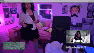 a woman stands in front of a screen that says daily subbies 22/3