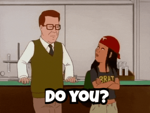 a man and a girl are standing next to each other and the girl has a brat shirt on