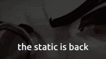 a close up of a person 's eyes with the words the static is back