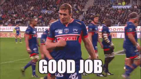 a group of soccer players are standing on a field and one of them is saying " good job "
