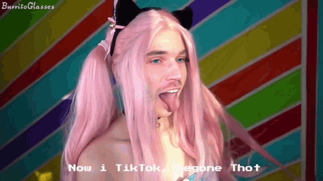 a man in a pink wig and cat ears says " now i tiktok "