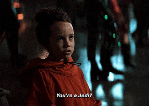a little girl in a red jacket says you 're a jedi