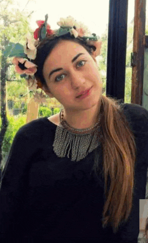 a woman with a flower crown on her head