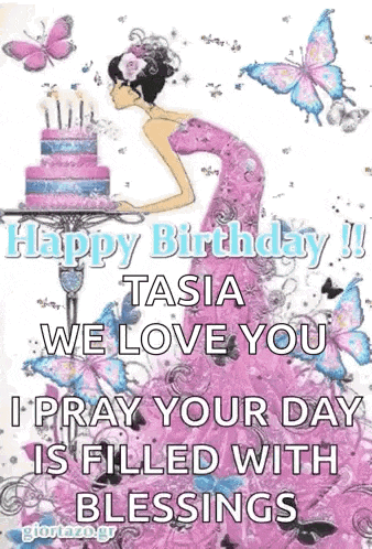 a woman in a pink dress is standing in front of a cake with butterflies .