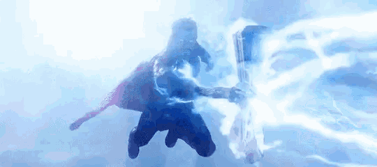 thor is flying through the air holding a hammer .