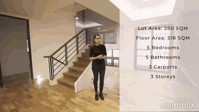 a woman is standing in front of a staircase with a lot area of 280 sqm and floor area of 518 sqm