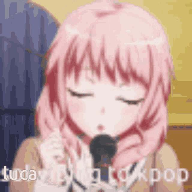 a girl with pink hair is holding a microphone in her hand .