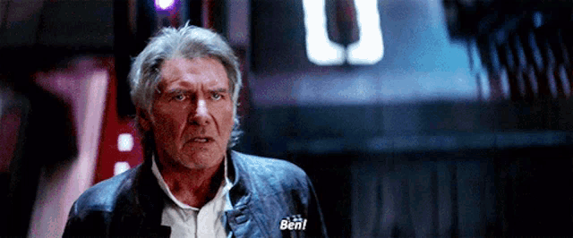 a man in a leather jacket says ben in front of a sign that says u.