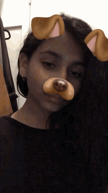 a girl wearing a dog face mask with ears