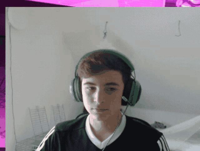 a boy wearing green headphones with a microphone