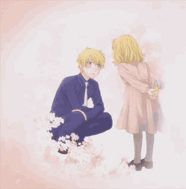 a little girl is holding flowers behind her back