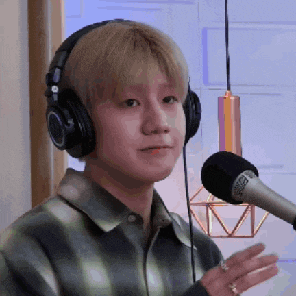 a young man wearing headphones and a microphone