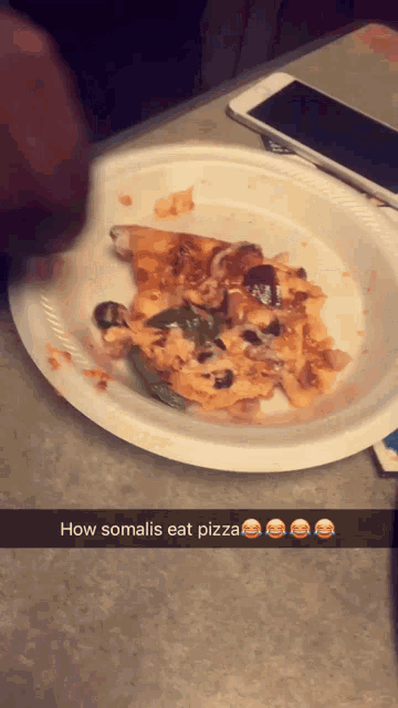a paper plate with a slice of pizza on it and the words how somalis eat pizza