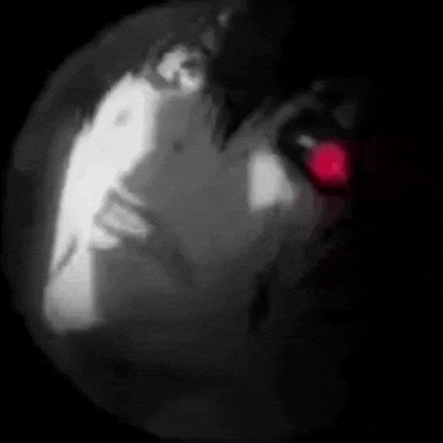 a black and white drawing of a person with a red light behind them .