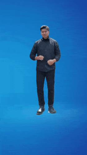 a man in a black shirt is standing on a blue background