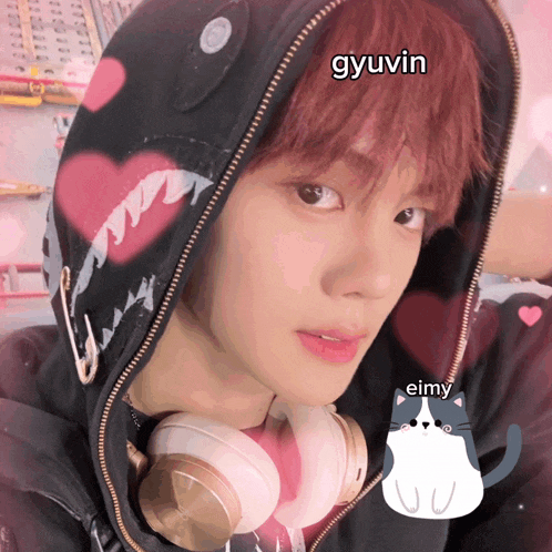 a person wearing headphones and a hoodie with the name gyuvin