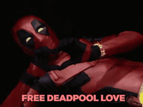 a man in a deadpool costume is laying down with the words " free deadpool love " above him