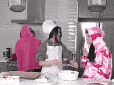 a woman wearing a chef 's hat is mixing something in a white bowl