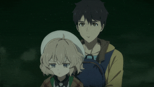 a boy and a girl standing next to each other