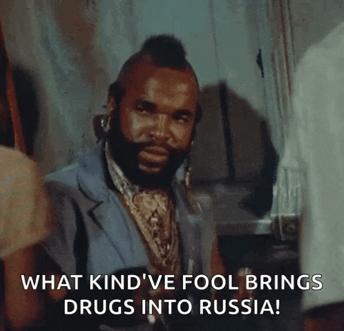 a man with a mohawk and a beard says what kind 've fool brings drugs into russia