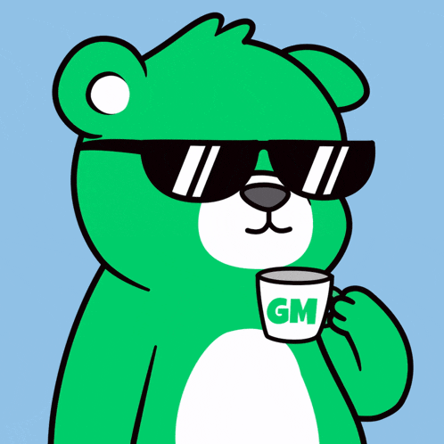 a green teddy bear wearing sunglasses is holding a cup with the letter gm on it
