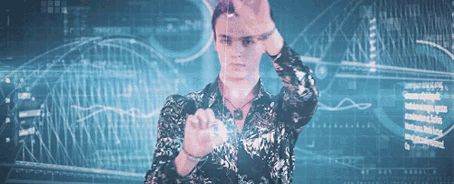 a man stands in front of a screen that says ' technology '