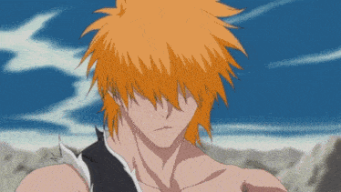 a close up of a man with orange hair and a blue sky in the background